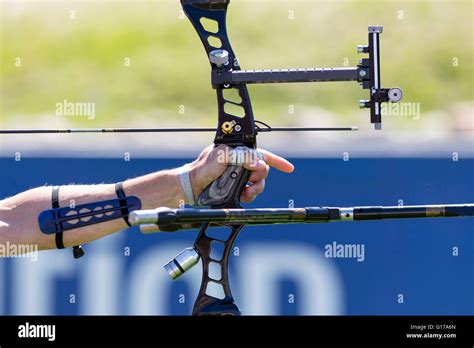 A man is shooting with a recurve bow during un open archery competition ...