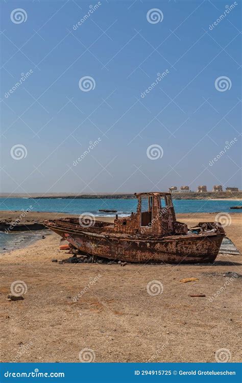 A Old Rusted Boat On The Sandy Beach East Coast Of Sal Island In Cape