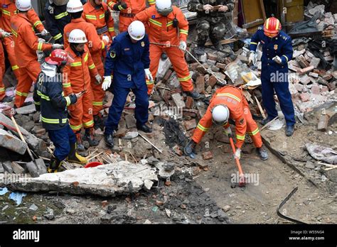 Chinese Rescuers Try To Save A Survivor From The Rubble Of A Collapse