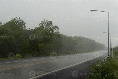 Rainy Road Stock Photos, Images and Backgrounds for Free Download