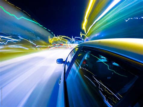 "Car Driving Fast In The Night City" by Stocksy Contributor "Studio ...