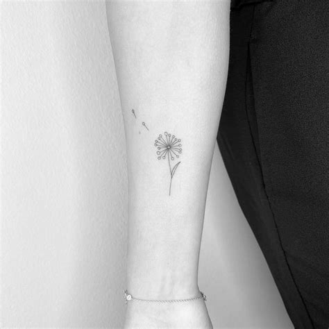 Fine Line Style Dandelion Tattoo Located On The Inner