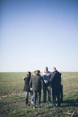 group holding hands  prayer stock  pearl