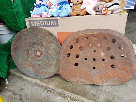 Vintage plow disc and tractor seat - River Market Antiques