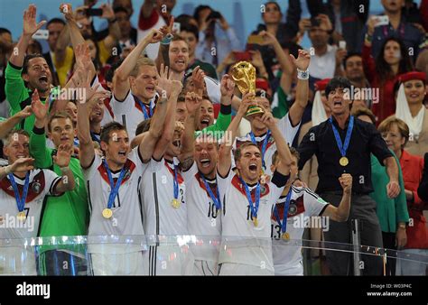 Philipp Lahm of Germany lifts the trophy following the 2014 FIFA World ...