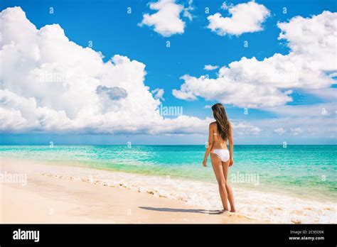 Beach Travel Luxury Vacation Bikini Woman Relaxing On Summer Holidays With Sky Landscape