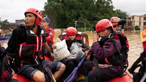 China Floods Four Dead As Cities Submerged After Days Of Record