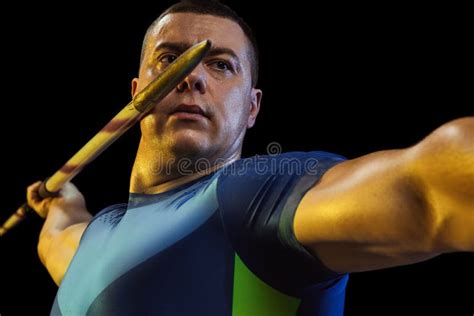 Male Athlete Practicing In Throwing Javelin Isolated On White Studio