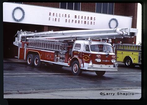 Two Fire Trucks Parked In Front Of A Building