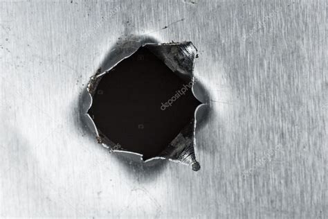 Bullet hole in sheet metal Stock Photo by ©Funniefarm5 14584093