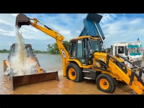 Jcb Dx Backhoe Loading Black Mud In Tata Truck And Tata Dump