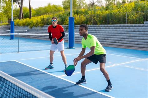 Premium Photo Multiracial Team Of Pickleball Players In An Outdoor Court