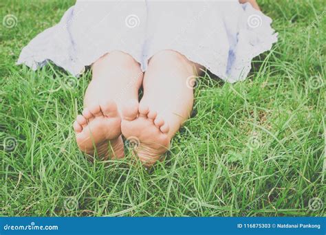 Barefoot Woman Laying Grass