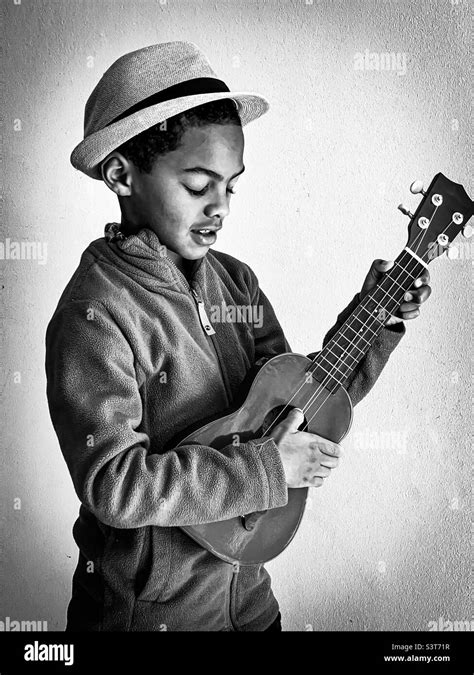 Boy ukulele Black and White Stock Photos & Images - Alamy