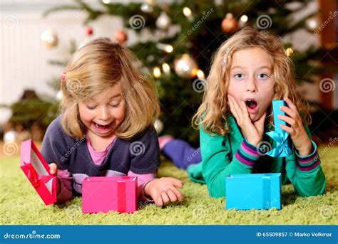 Two Amazed Girls With Christmas Presents Stock Image Image Of Child