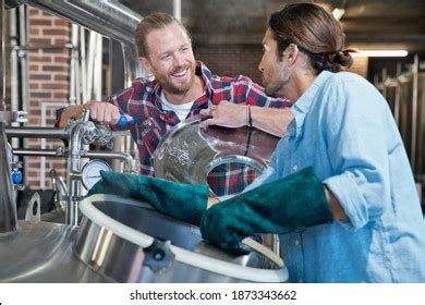 Brewery Workers Checking Fermentation Process Steel Stock Photo