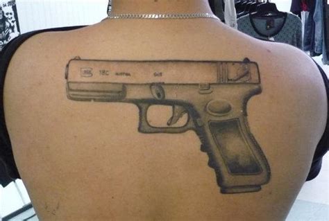 45 Amazing Gun Tattoo Designs