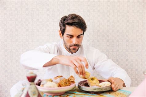 Free Photo | Muslim man eating arab food