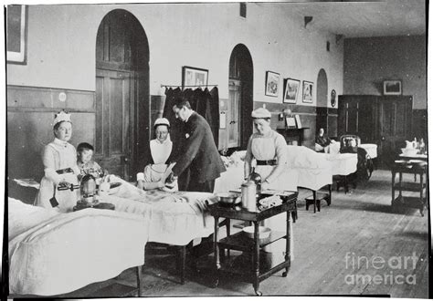 Hospital Scene With Doctor And Nurses By Bettmann