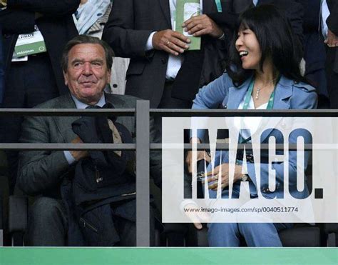 on the VIP grandstand former Chancellor Gerhard Schröder with wife