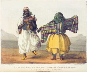 Two Women Dressed In African Clothing One Carrying A Baby And The