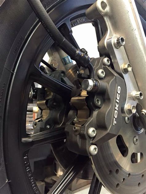 A Pair Of Tokico Brake Calipers Adapted To A Harley Davidson From