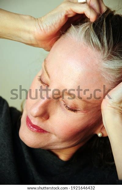 Mature Female Blond Beauty Expressions Indoors Stock Photo