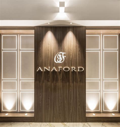 The Entrance To An Office Building With Wood Paneling And Glass Doors