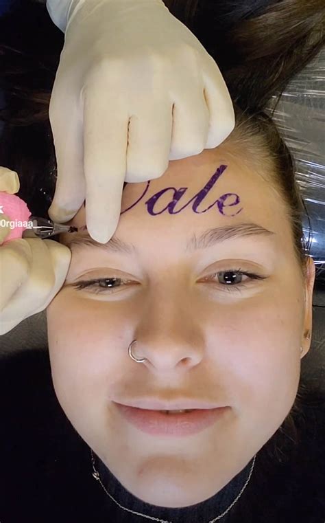 Another woman got a forehead tattoo of her boyfriend’s name — but revealed it was for clout