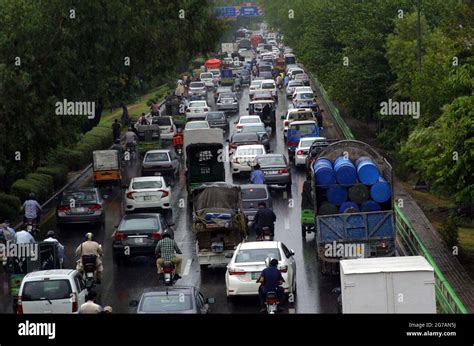 A Large Numbers Of Vehicles Stuck In Traffic Jam During Heavy Downpour