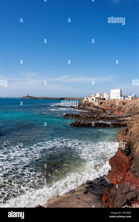 El Puerto De La Cruz Behind Punta De Jandia Lighthouse Peninsula