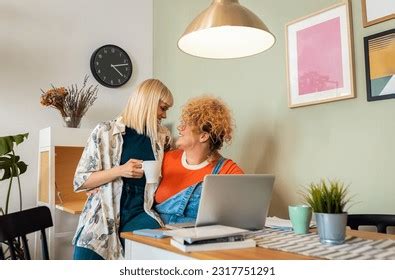 Lesbian Couple Laughing Hugging While Using Stock Photo Shutterstock