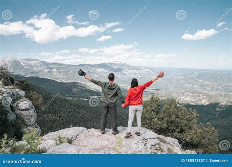 Hikers Relaxing on Top of a Mountain and Enjoying the View of Valley ...