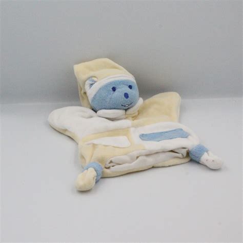 Doudou Plat Marionnette Ours Bleu Blanc Jaune Mustela