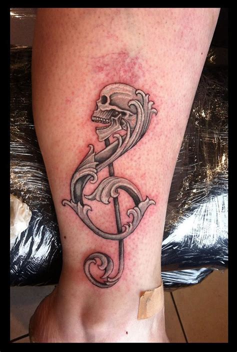 treble clef skull tattoo | Music tattoo designs, Treble clef tattoo ...