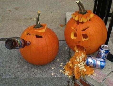 Two Pumpkins With Faces Carved Into Them Sitting On The Sidewalk Next