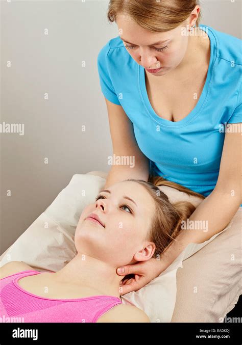 Osteopathy Treatment The Professional Masseuse And Her Patient Stock