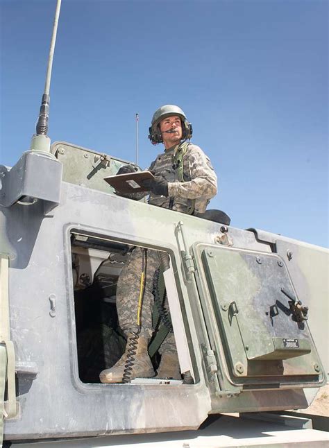 A crew member of an M109A6 Paladin self-propelled howitzer - PICRYL ...