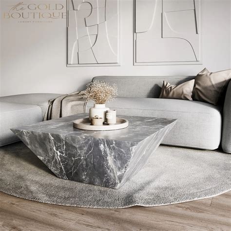 A Modern Living Room With Marble Coffee Table