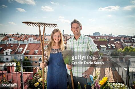 Couple On Balcony Holding Garden Tools Munich Bavaria Germany Europe ...