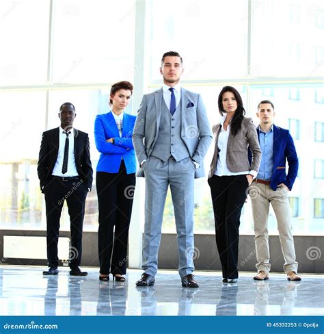 Group Portrait Of A Professional Business Team Looking Confidently