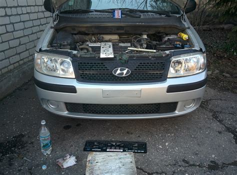 Огибающая накладка на бампер под гос. номер. — Hyundai Matrix, 1,6 л ...