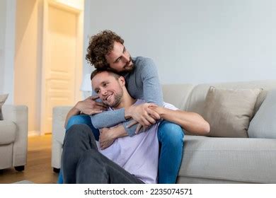Lovely Gay Couple Kissing While Sitting Stock Photo 2235074571 Shutterstock