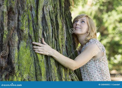 Woman Hugging Large Tree Trunk While Looking Up Stock Photo Image Of