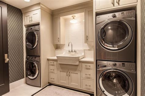 Contemporary Laundry Room With Two Sets Of Stacked Washers And Dryers