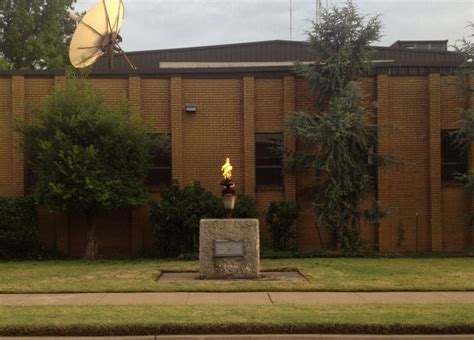 the Old Rogers County Court House behind the Flame in Rogers County, OK ...