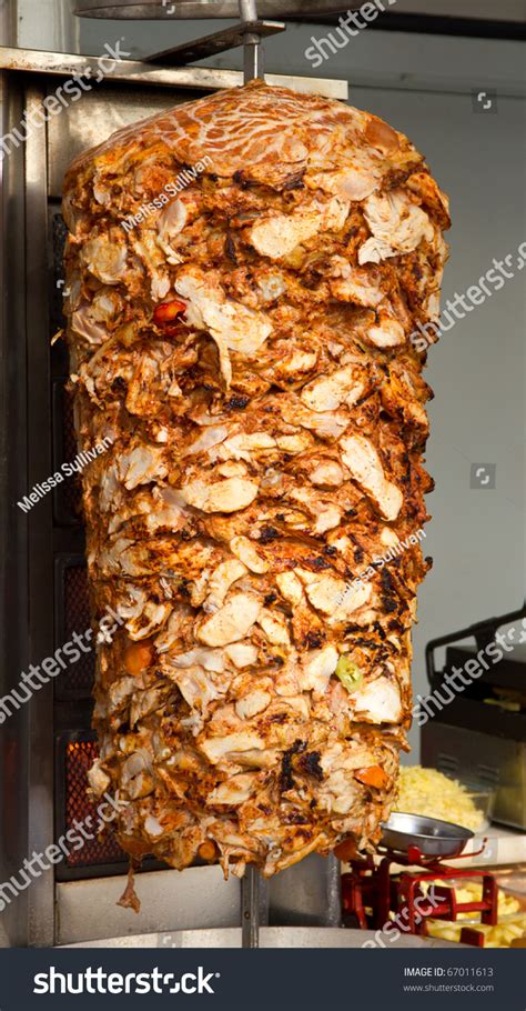 Chicken Cooking On Rotating Vertical Spit For Turkish Doner Kebab Stock