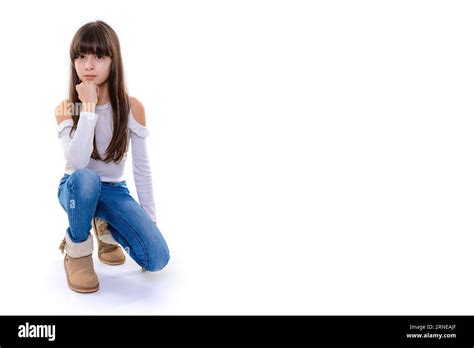 Brunette Girl Look Straight Into Camera With Hand Lean On Chin Stock Photo Alamy