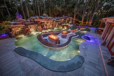 This Guitar Shaped Pool Features a Rock Waterfall and Swim-up Bar - Mad ...