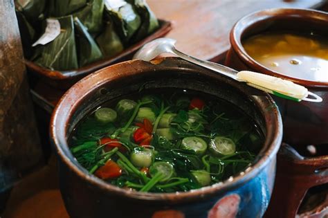 Premium Photo | Sayur bayam bening on the clay pot indonesian ...